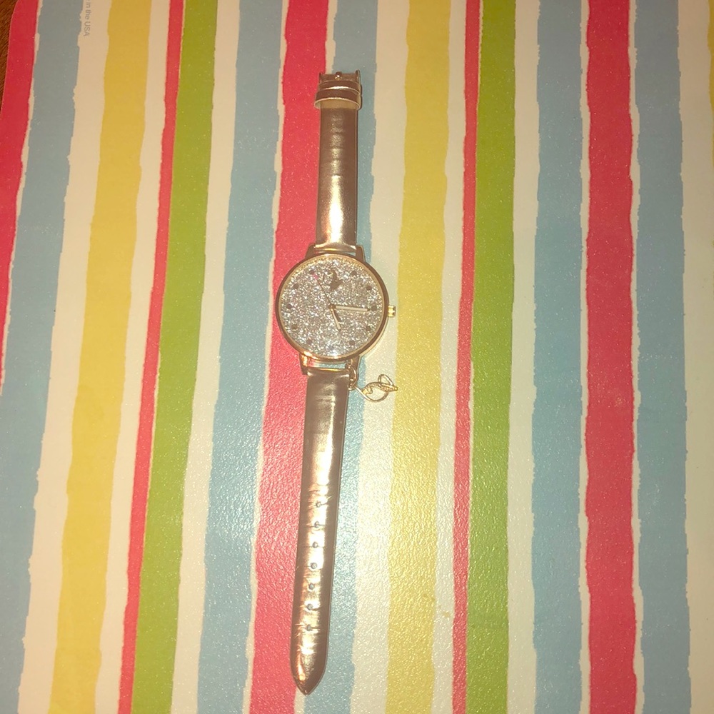 Classy & Sleek, Women’s Baby Phat watch.